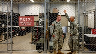 OMD, Colonel Nesmith Readiness Center indoor facility, two army soldiers standing by the gate