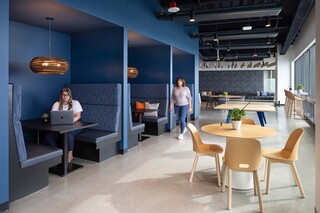 Indeed at Qualtrics Tower common area booth seating