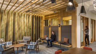 One Esterra common area, small conference pods, and study area