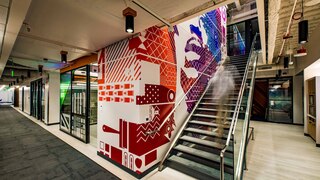 Staircase and colorful art on wall in the office, Bellevue and Seattle, Washington | Hillsboro and Portland, Oregon