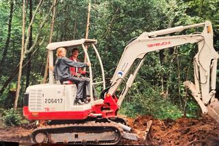 Sharaya Hays would spend summer breaks on her dad’s jobsites. Here, they pose on a small excavator in 2004.
