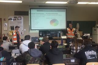 Jared Thompson and Carpenter Maya Burns-Janousek give a presentation to a class at Sam Barlow High School
