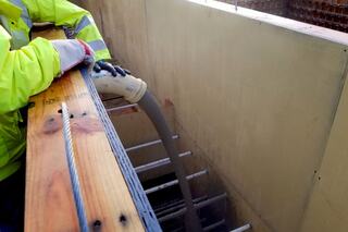 Lewis crews test the unique blend of aggregate-free concrete mix in the first mockup