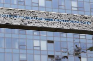 Seattle Children’s Building Cure project members affirmed their support by signing a steel beam, which included the project charter.