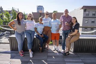 A group of people with Pride shirts on at Lease Crutcher Lewis