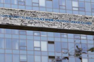 Seattle Children’s Building Cure project members affirmed their support by signing a steel beam, which included the project charter.
