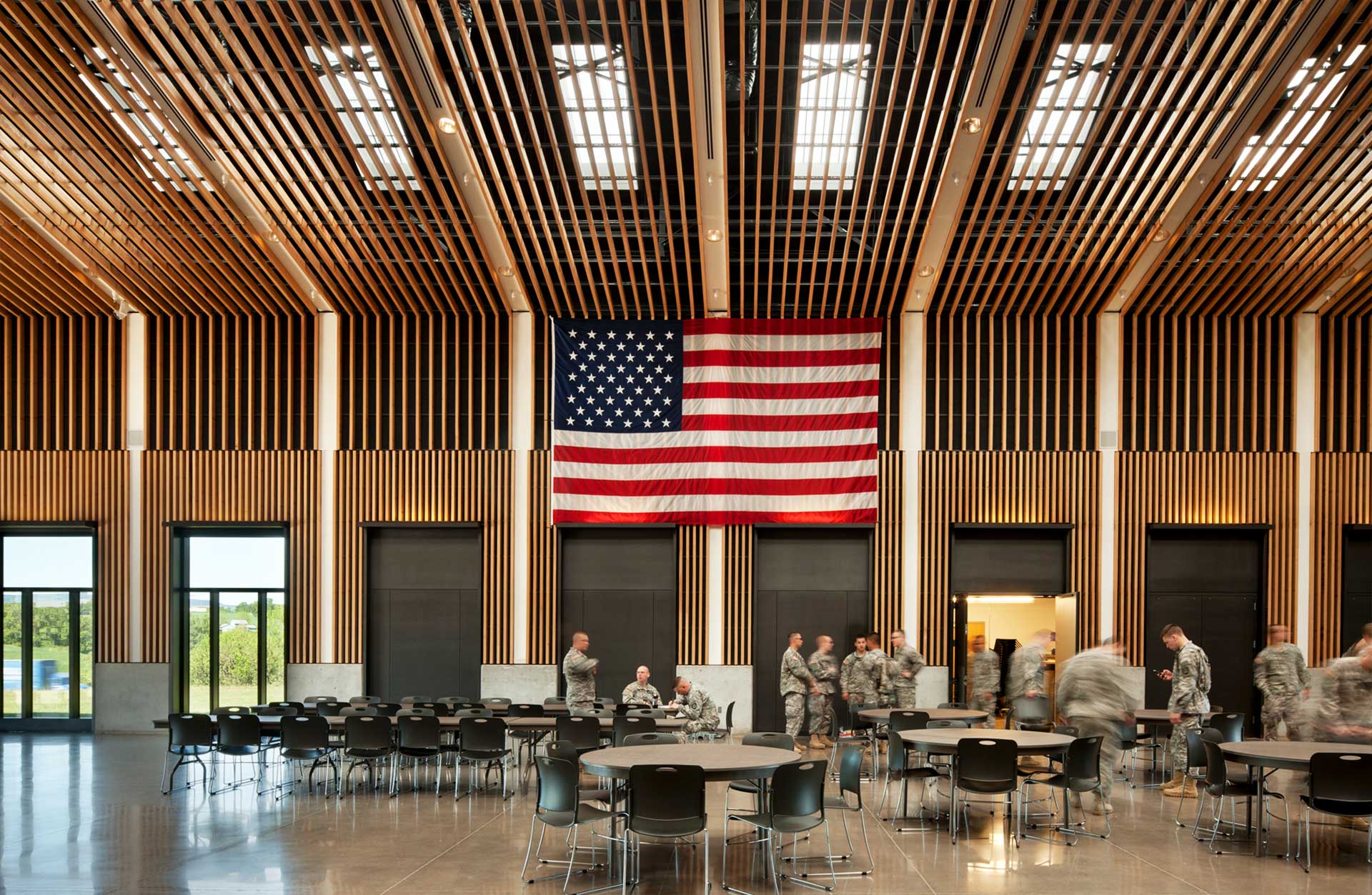 Colonel Neosmith Readiness Center interior with combat engineers in uniform and American flag