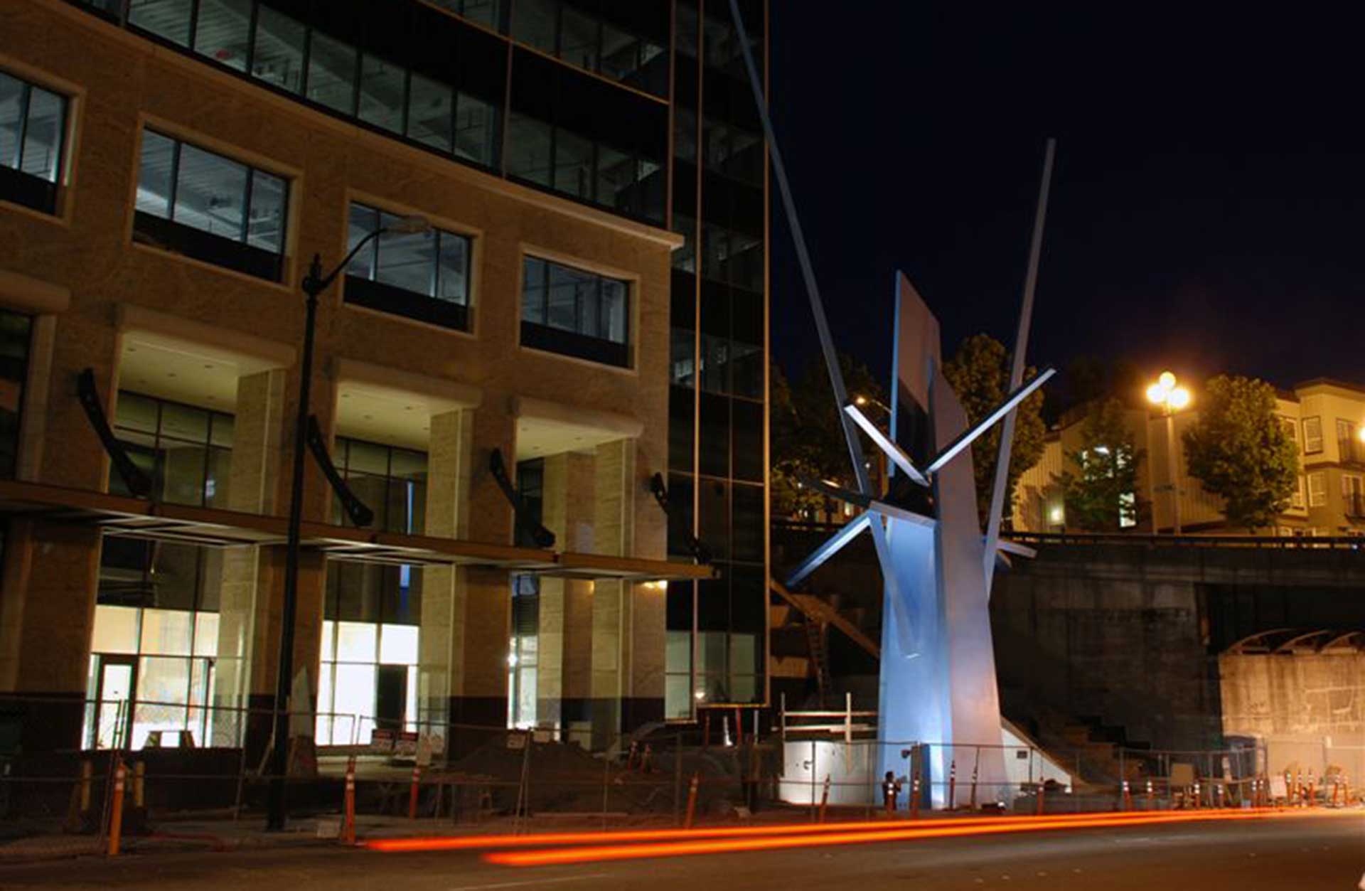 5th and Yesler exterior at night with statue