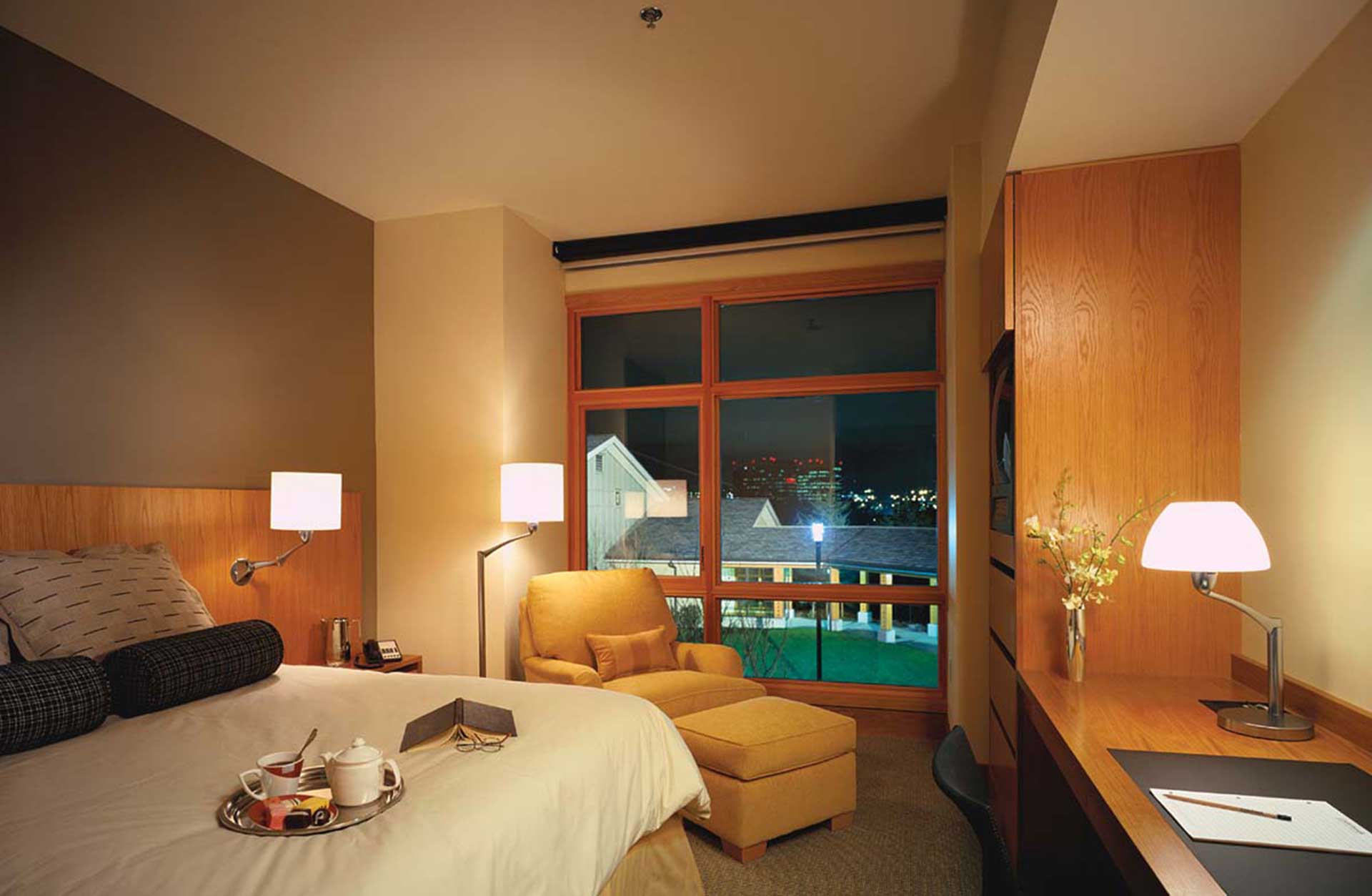 Cedarbrook Lodge guestroom at night with room service delivered