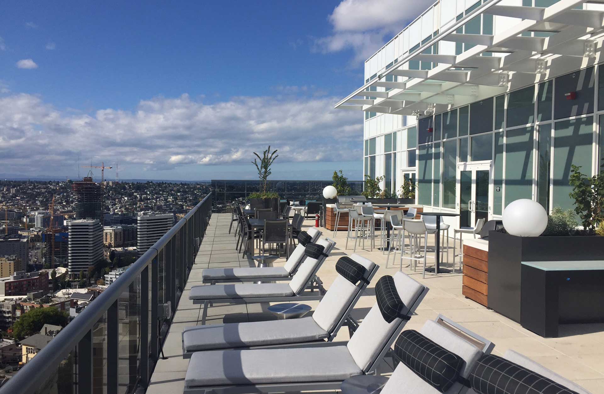 Luma Condominiums roof seating with view of Seattle skyline