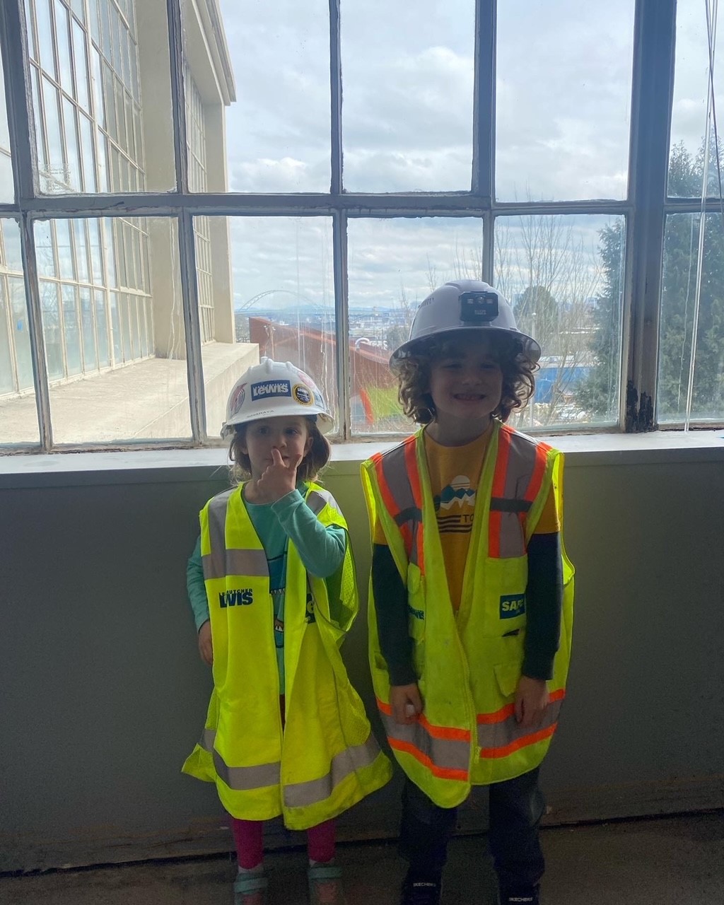 Sharaya’s children, Reagan and Asher, pose for a photo at Lewis’ Avangrid project.